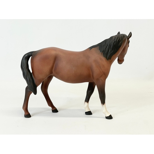 393 - A Royal Doulton pottery horse. 22x17cm