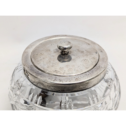 402A - A silver top crystal jar. 12cm