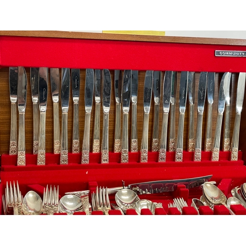 465 - A large canteen of cutlery. Silver plate. By Community. Case measures 53.5x28x8cm