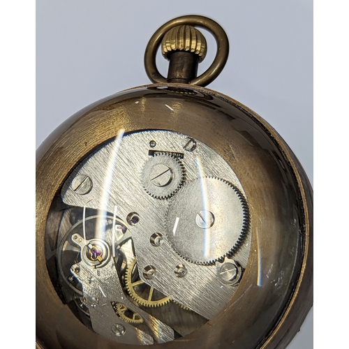 528 - An Omega style glass and brass globe clock. 6x8cm