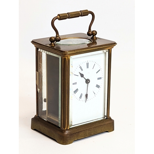 61 - A late 19th century brass carriage clock. 8x10.5cm