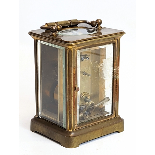 61 - A late 19th century brass carriage clock. 8x10.5cm