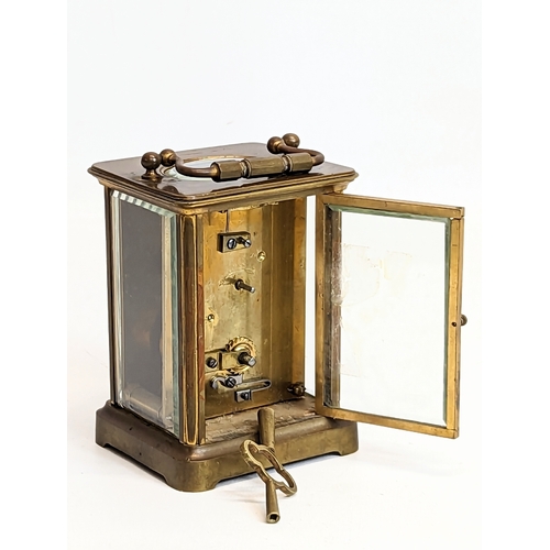 61 - A late 19th century brass carriage clock. 8x10.5cm