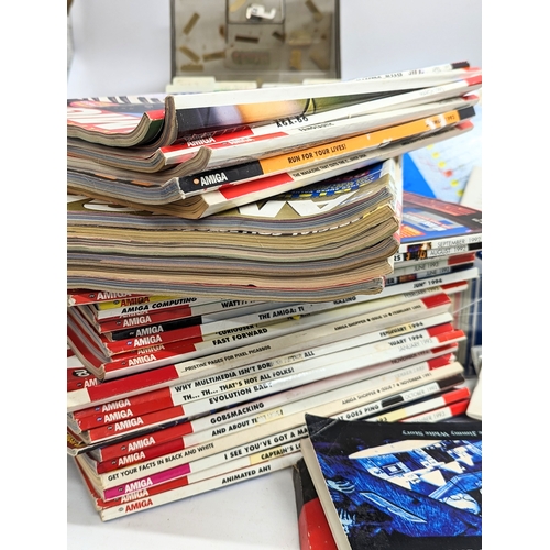 138 - A large quantity of Commodore Amiga games, Amiga floppy disks, Amiga magazines, etc.