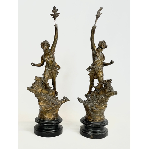 63 - A pair of late 19th century Spelter figures on wooden bases. 49cm