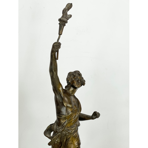 63 - A pair of late 19th century Spelter figures on wooden bases. 49cm