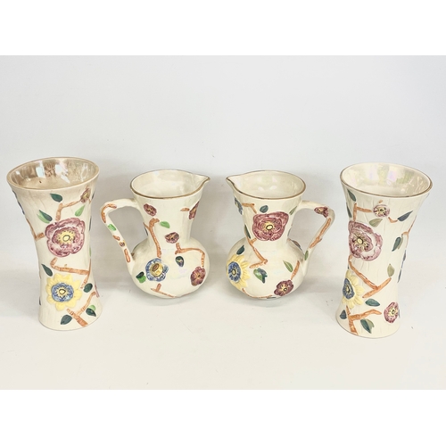 480 - 4 pieces of Arthur Wood lustre pottery. A pair of jugs 20x21cm and a pair of vases 25.5cm