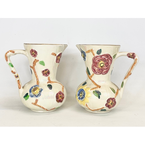 480 - 4 pieces of Arthur Wood lustre pottery. A pair of jugs 20x21cm and a pair of vases 25.5cm