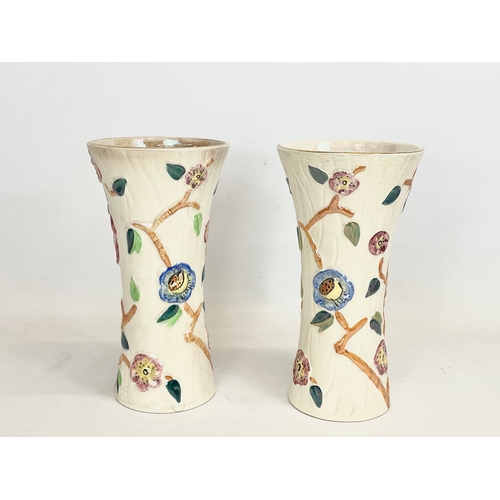 480 - 4 pieces of Arthur Wood lustre pottery. A pair of jugs 20x21cm and a pair of vases 25.5cm