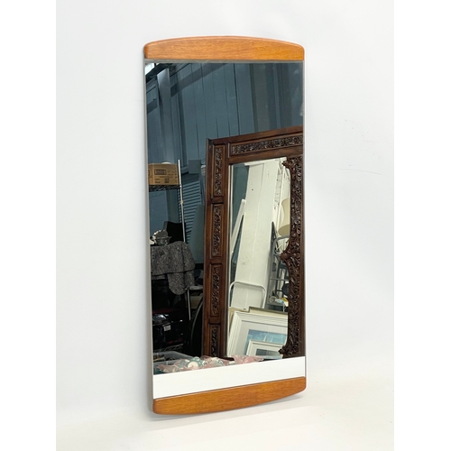 69 - A Mid Century teak framed mirror. 75x35.5cm