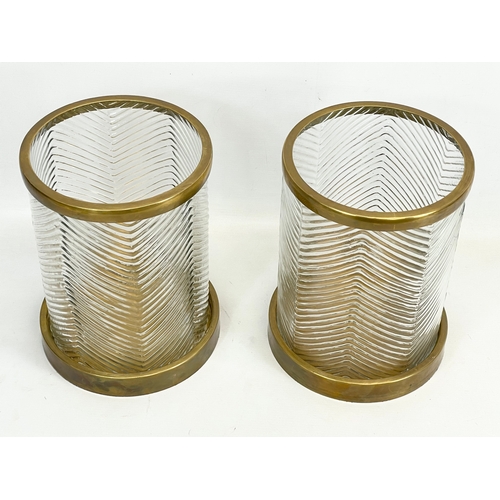 73 - A pair of large glass and brass Hurricane candleholders, by Eichholtz Paloma. 22x29cm