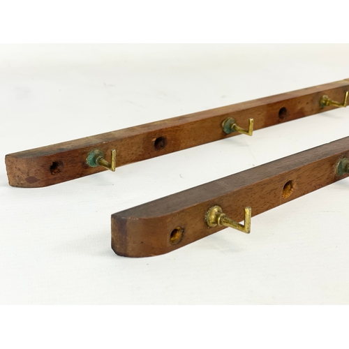 96 - 4 Victorian mahogany hat racks with brass hooks. 33.5cm each.