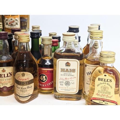 97 - A quantity of mostly unopened alcohol miniatures, including Johnnie Walker Black Label Scotch Whisky... 