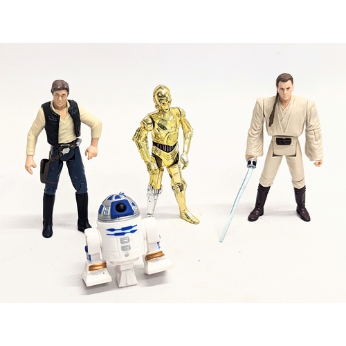 149 - A collection of Star Wars figures, including Hans Solo, Darth Vader, Chewbacca, R2-D2, C-3PO, Obi wa... 