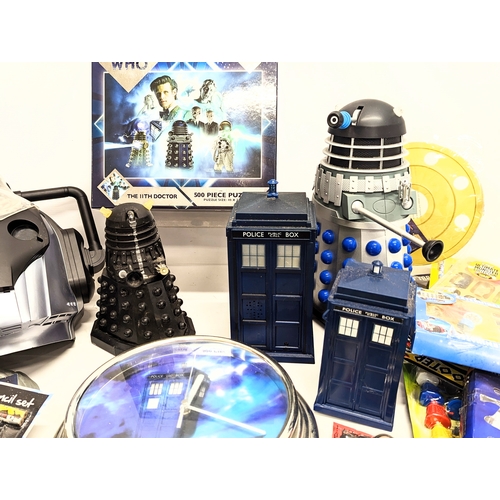 151 - A collection of Doctor Who merchandise and toys, including puzzle, Cyberman mask, The 11th Doctor Ma... 