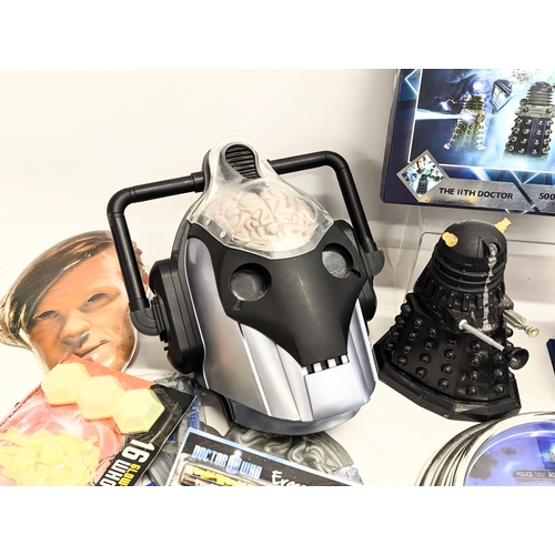 151 - A collection of Doctor Who merchandise and toys, including puzzle, Cyberman mask, The 11th Doctor Ma... 