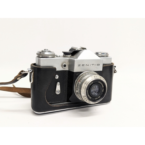 152 - A vintage Zenit-B 35mm camera, made in USSR in original case with strap. With a 1955 Kodak 'Bantam' ... 