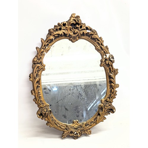 112 - An early 20th century mirror. 52x42cm