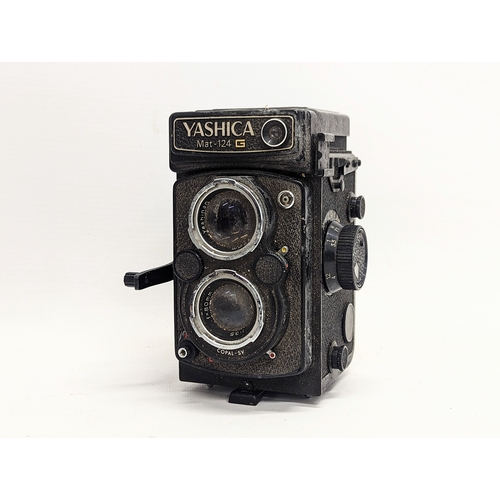 158 - A Kodak EK160-EF instant camera with electronic flash in original case with a vintage Yashica Mat-12... 