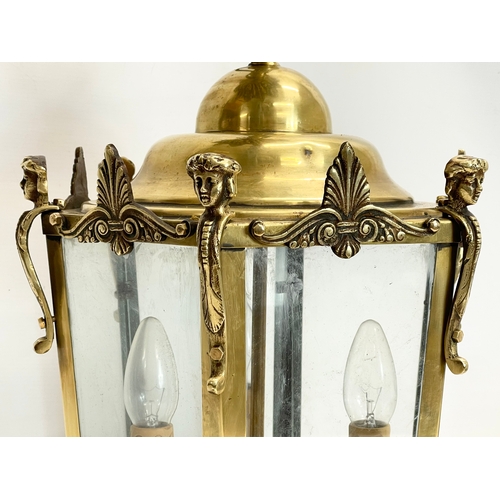 115 - A large good quality heavy brass light fitting. 33x54cm