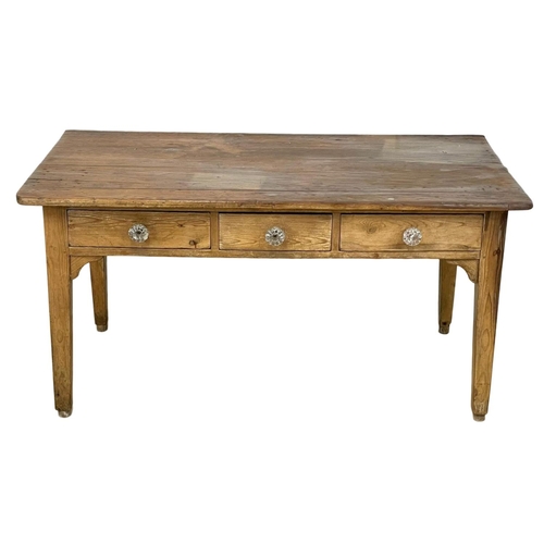 919 - A Victorian pine Farmhouse kitchen table with 3 drawers and Victorian glass handles. 160x87x80cm