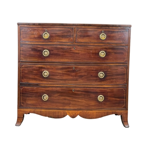 921 - A George III inlaid mahogany bow front chest of drawers. Circa 1800. 108 x 59 x 98cm