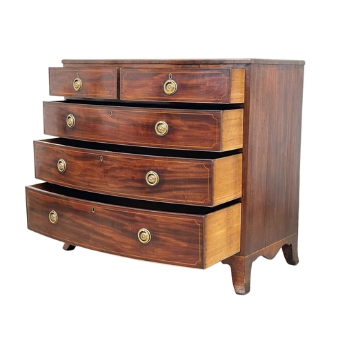 921 - A George III inlaid mahogany bow front chest of drawers. Circa 1800. 108 x 59 x 98cm