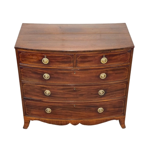 921 - A George III inlaid mahogany bow front chest of drawers. Circa 1800. 108 x 59 x 98cm