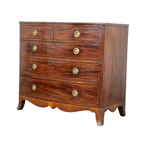 921 - A George III inlaid mahogany bow front chest of drawers. Circa 1800. 108 x 59 x 98cm