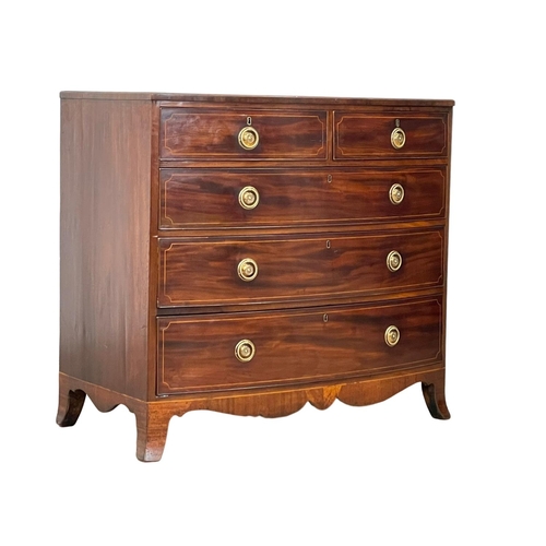 921 - A George III inlaid mahogany bow front chest of drawers. Circa 1800. 108 x 59 x 98cm