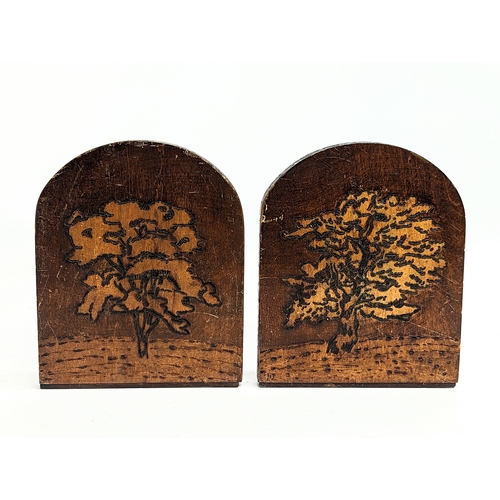 117 - A pair of vintage bookends with pokerwork decoration