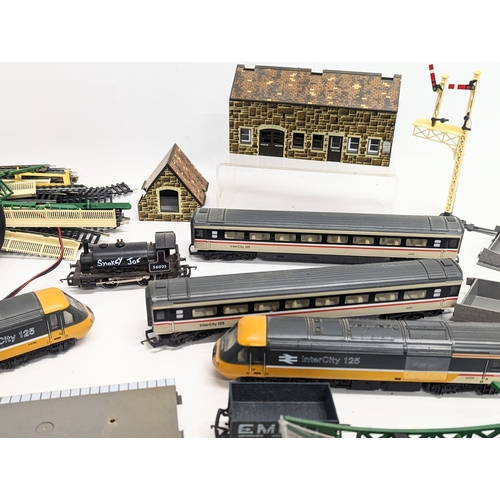 165 - A collection of Hornby trains and railway tracks