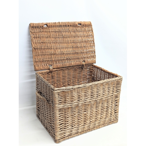 377 - A vintage heavy wicker basket. 59.5x40x36.5cm