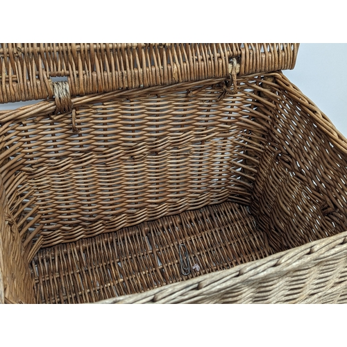 377 - A vintage heavy wicker basket. 59.5x40x36.5cm