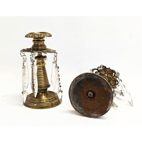 122 - A pair of Victorian brass candlesticks with glass droplets. 16.5xcm