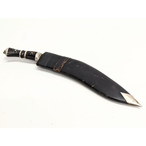 124 - A vintage Gurkhas' kukri in sheath