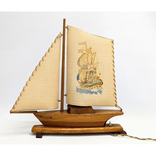 167 - A 1930s lamp in the form of a yacht. 46x45.5cm