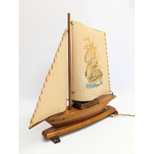 167 - A 1930s lamp in the form of a yacht. 46x45.5cm