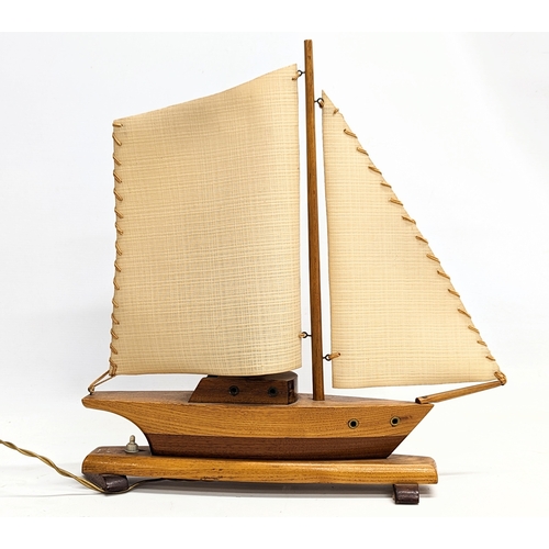 167 - A 1930s lamp in the form of a yacht. 46x45.5cm