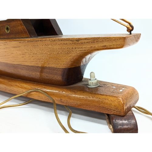 167 - A 1930s lamp in the form of a yacht. 46x45.5cm