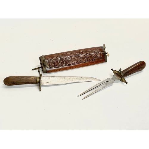 208 - A vintage carving set. 45cm