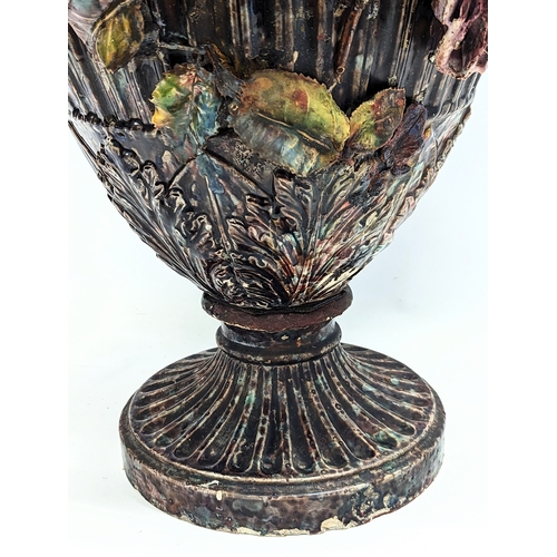 424 - A large late 19th century Barbotine Majolica pottery vase with roses and rams head decorations. 72.5... 