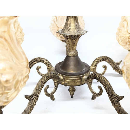 217 - A vintage ornate brass chandelier