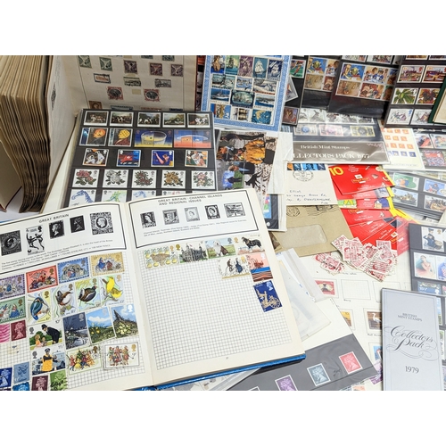 586 - A large quantity of vintage stamps, badges, stamp albums, bank notes