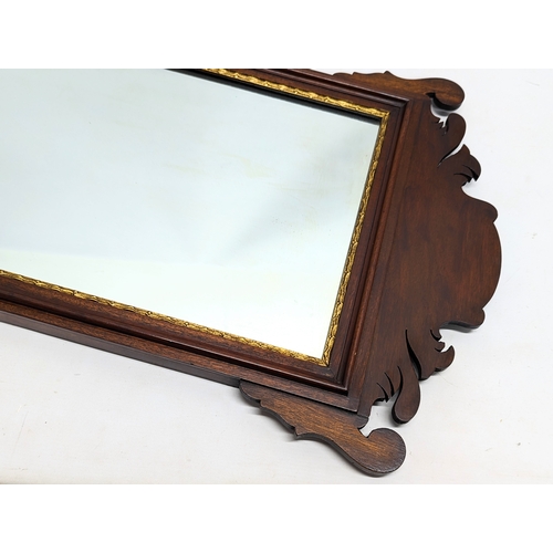 218 - A late 19th century Regency style mahogany framed mirror, circa 1890. 51.5x92.5cm