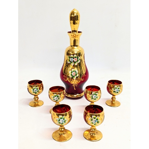 724 - A 7 piece vintage Italian ruby glass drinks set. Decanter measures 28cm