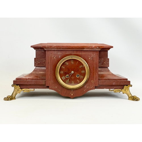 220 - A large Victorian slate mantle clock, with brass paw feet. Including pendulum and key. 49x25x20.5cm