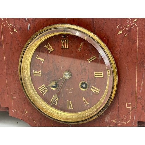 220 - A large Victorian slate mantle clock, with brass paw feet. Including pendulum and key. 49x25x20.5cm