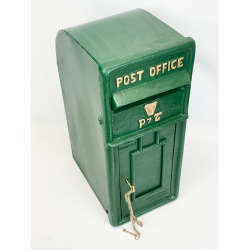 224 - A cast iron postbox with key. 25x35x59cm