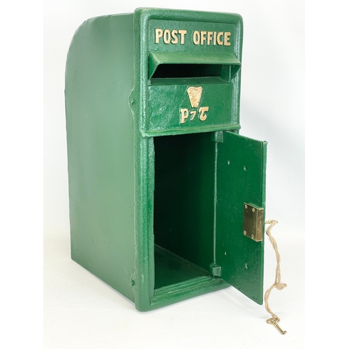 224 - A cast iron postbox with key. 25x35x59cm